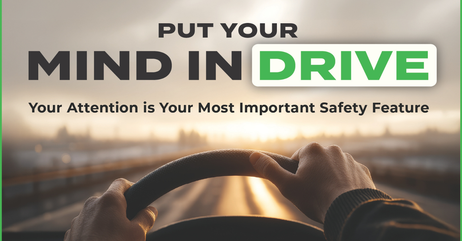 person's hands on a steering wheel looking at the road at dusk with words that say Put your mind in drive. Your attention is your most important safety feature.